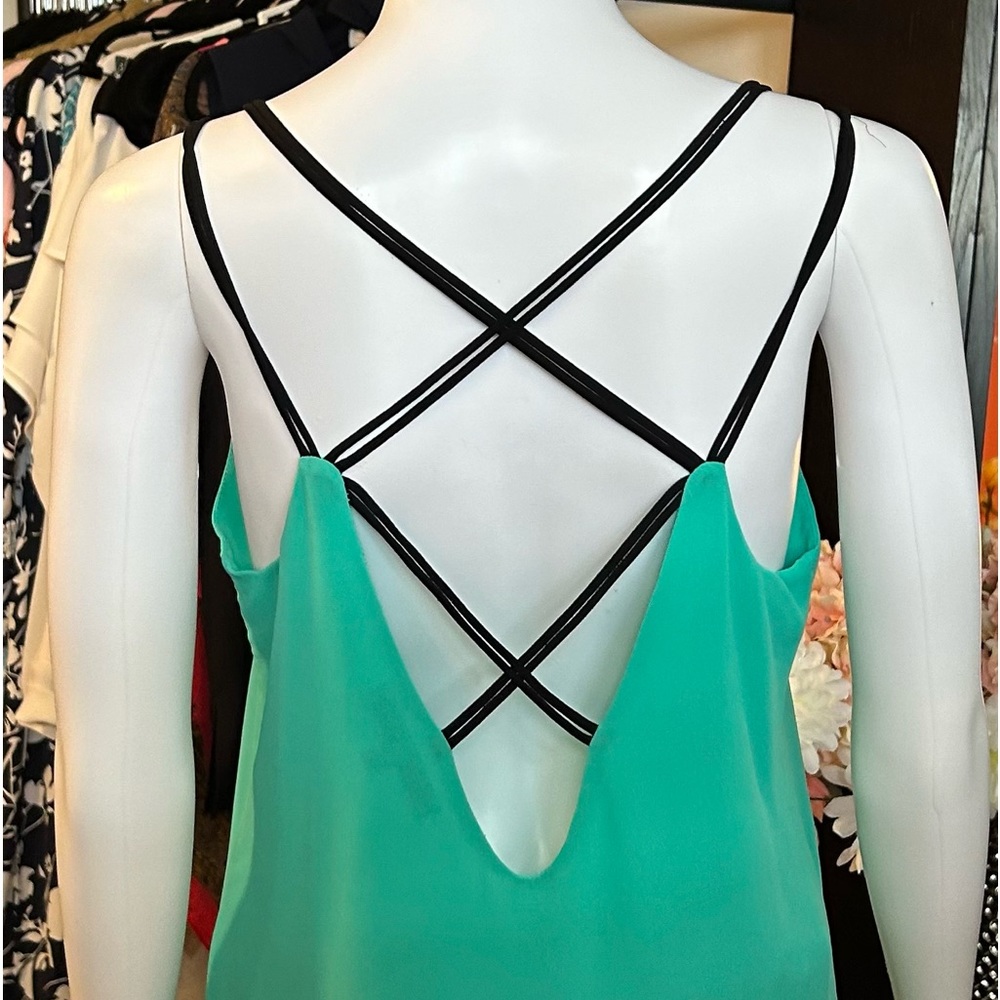 Gorgeous green flowy tank with multiple black straps in the back!